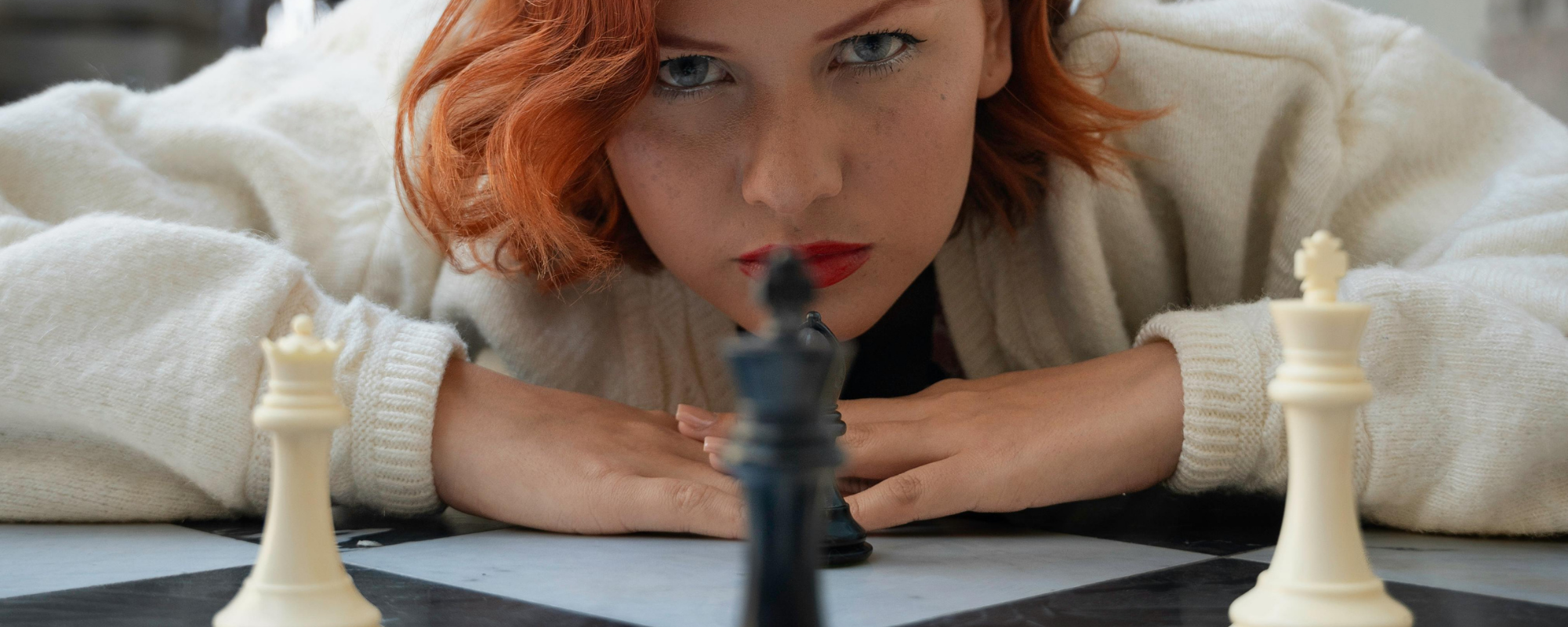 Women playing chess - strategising